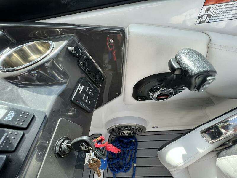 2022 Monterey M-45 boat cockpit with control panel, steering wheel, and ignition keys.