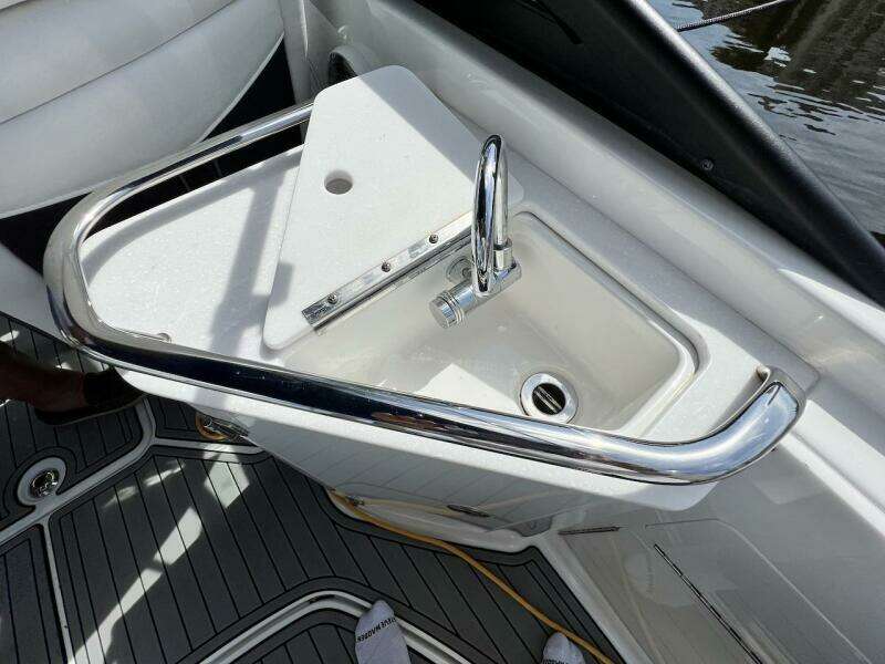 2022 Monterey M-45 boat sink with chrome faucet and safety rail.