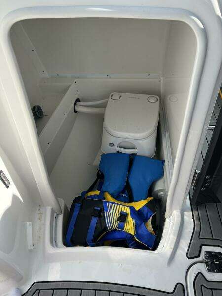 2022 Monterey M-45 boat interior with portable toilet and life jackets.