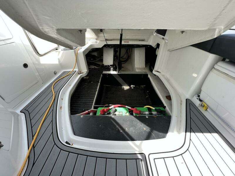 2022 Monterey M-45 boat engine compartment with open hatch and visible battery.