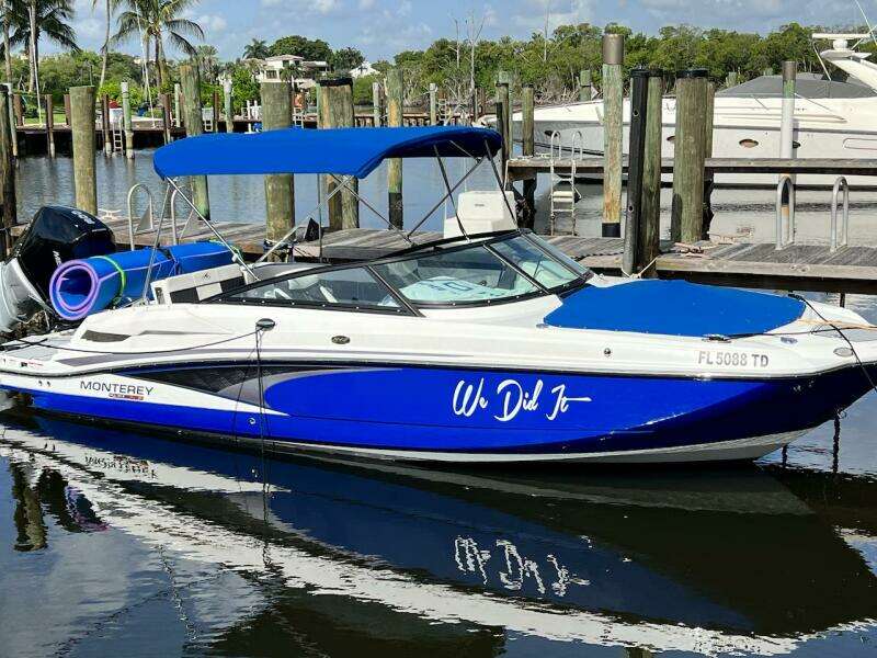 Blue and white 2022 Monterey M-45 boat docked at marina.