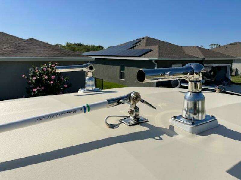 2014 Grady-White Fisherman 257 boat with mounted fishing rod holders.