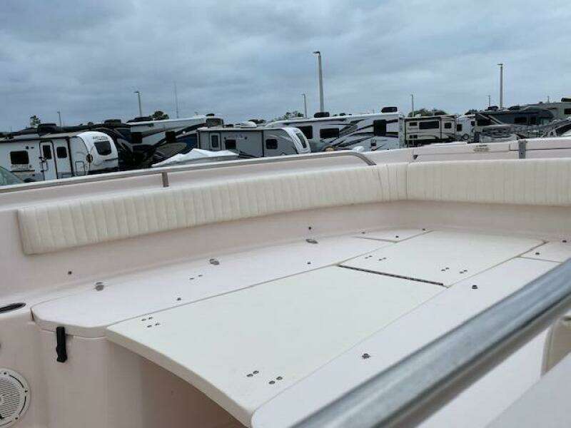 2014 Grady-White Fisherman 257 boat interior with white seating and storage compartments.