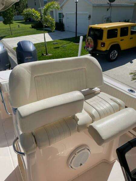 2014 Grady-White Fisherman 257 boat seat and console in a residential driveway.