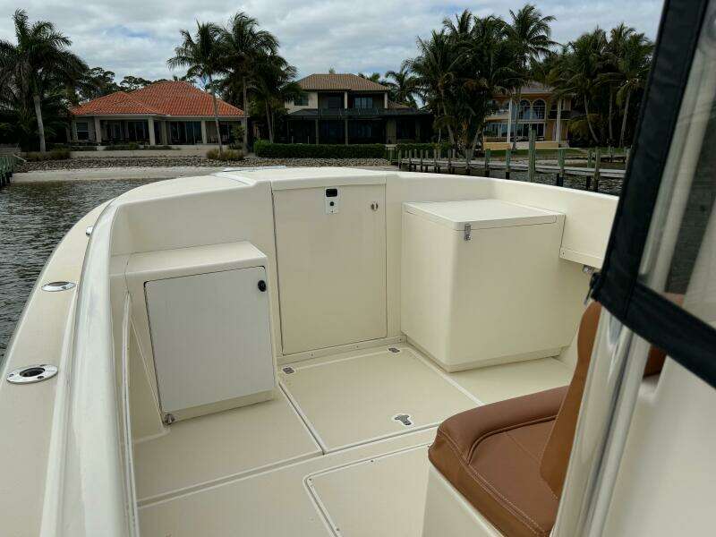 2004 Intrepid 32 Cuddy boat interior with seating and storage compartments.
