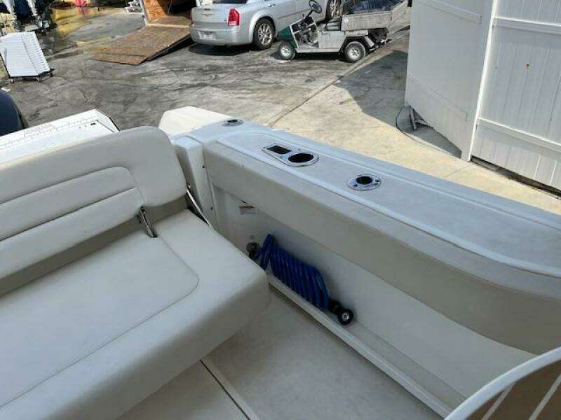 2018 Boston Whaler 270 Vantage boat interior with white seating and storage compartment.