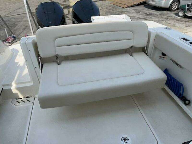 2018 Boston Whaler 270 Vantage boat with foldable rear bench seat.