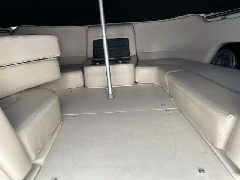 2018 Boston Whaler 270 Vantage boat interior with beige seating and storage compartments.