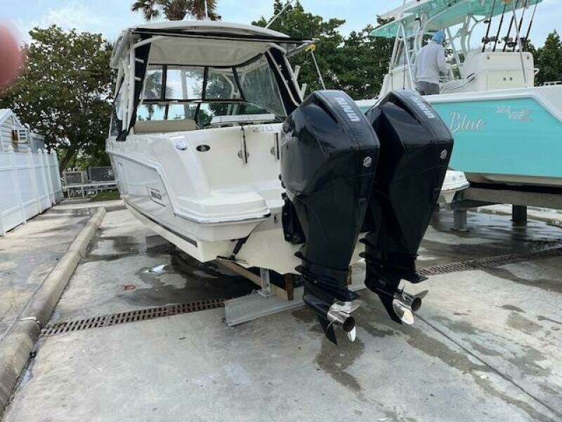 2018 Boston Whaler 270 Vantage with twin outboard engines on a trailer.