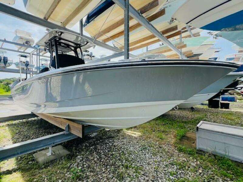 2023 Boston Whaler 250 Dauntless boat on storage rack, side view.
