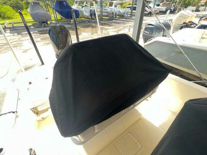 2023 Boston Whaler 250 Dauntless boat with covered seating area.