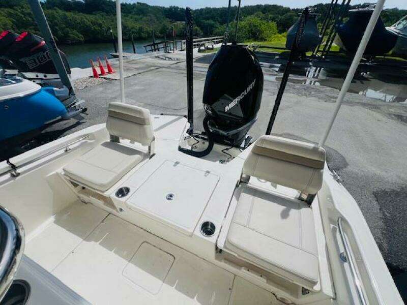 2023 Boston Whaler 250 Dauntless boat interior with seating and Mercury engine.