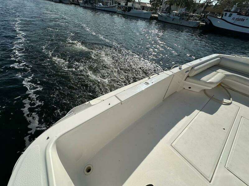 1997 Sea Ray 550 Sedan Bridge boat deck with water view.
