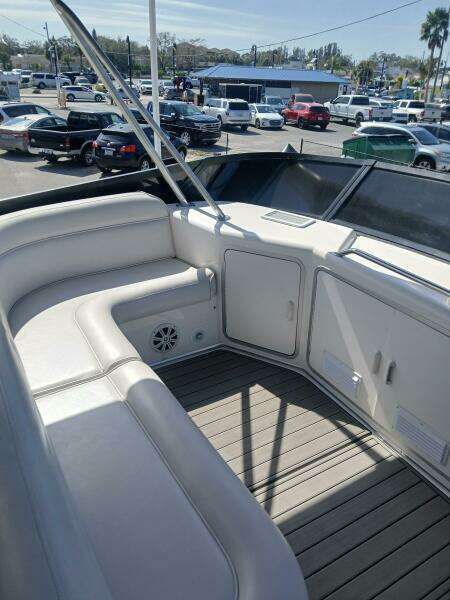 1997 Sea Ray 550 Sedan Bridge yacht with spacious seating and sleek design.