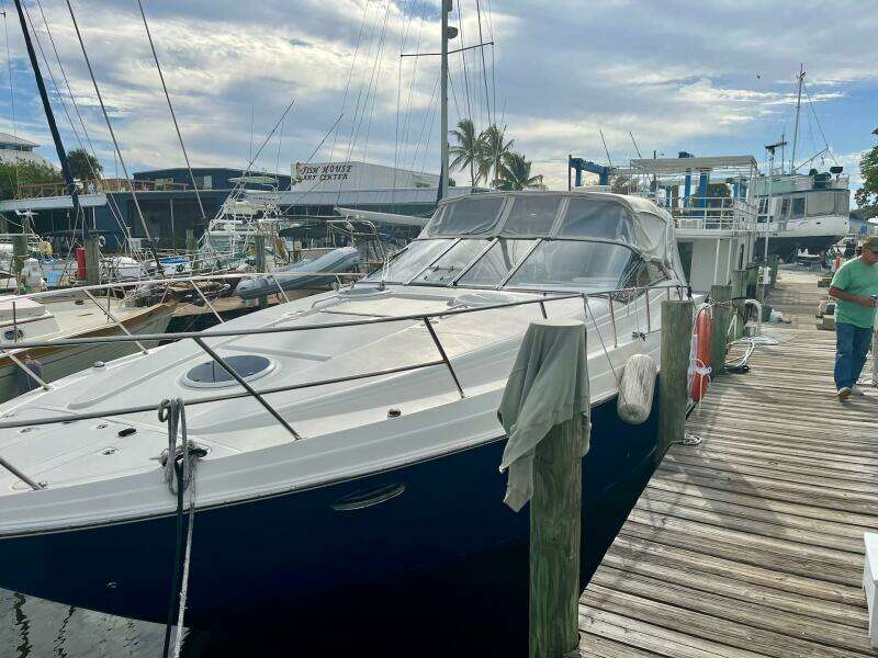 2003 Regal Commodore 3860 yacht docked at a marina.