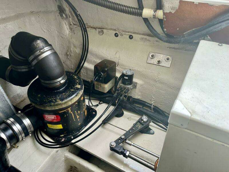 Engine compartment of a 2003 Regal Commodore 3860 boat with various mechanical components.