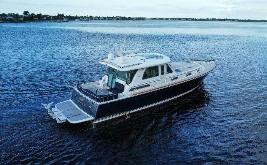 2013 Sabre 48 Salon Express yacht cruising on calm waters.