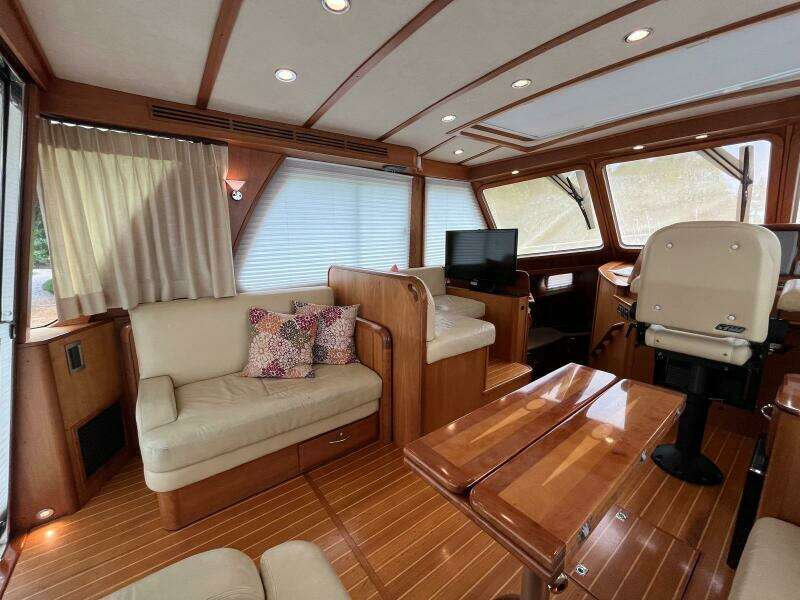 Luxurious interior of 2013 Sabre 48 Salon Express yacht with elegant wood finishes.