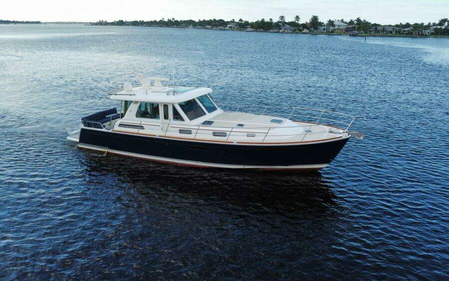 2013 Sabre 48 Salon Express yacht cruising on calm waters.