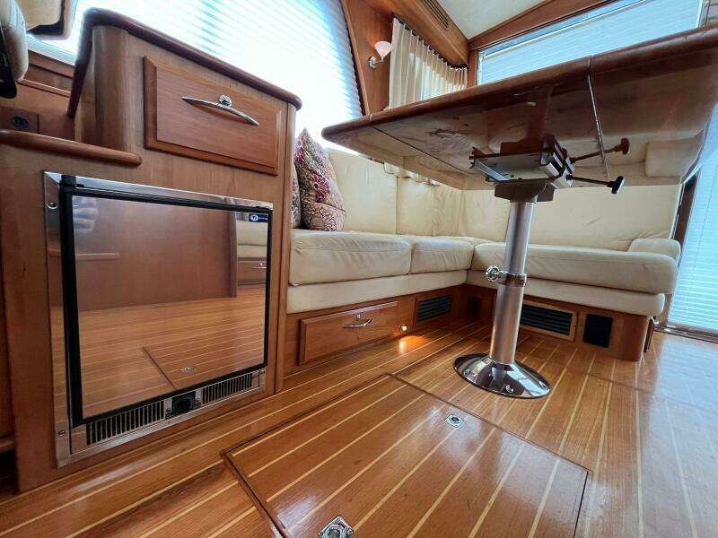 2013 Sabre 48 Salon Express interior with wood flooring and cozy seating area.