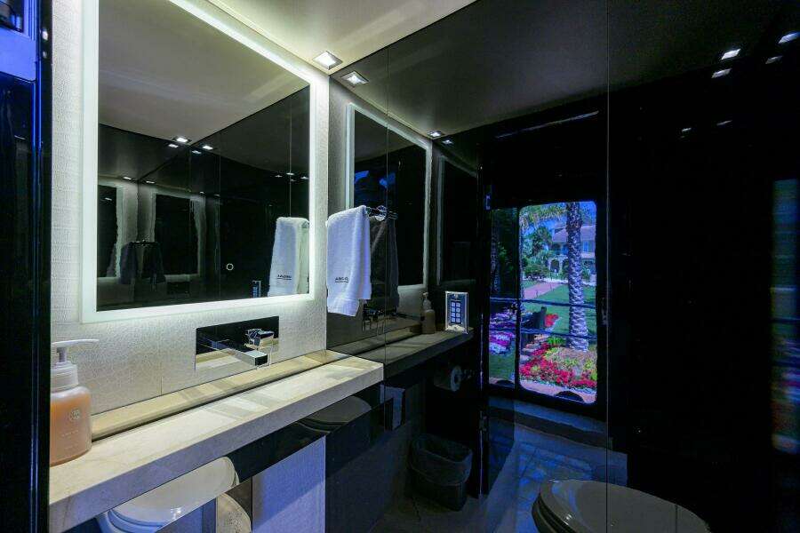Luxurious bathroom on a 1997 Broward 108 Raised Pilothouse yacht with modern fixtures.