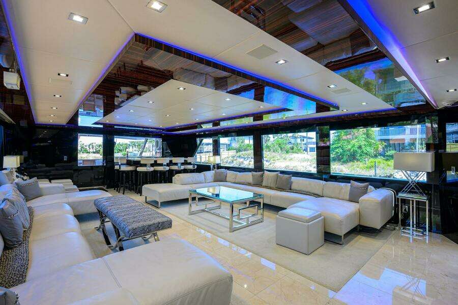 Luxurious interior of 1997 Broward 108 Raised Pilothouse yacht with modern furnishings.
