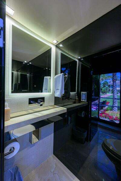 Luxurious bathroom in a 1997 Broward 108 Raised Pilothouse yacht.