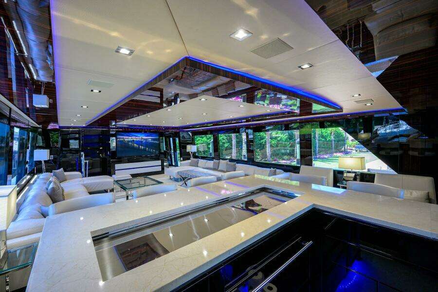 Luxurious interior of 1997 Broward 108 Raised Pilothouse yacht with modern design and ample seating.
