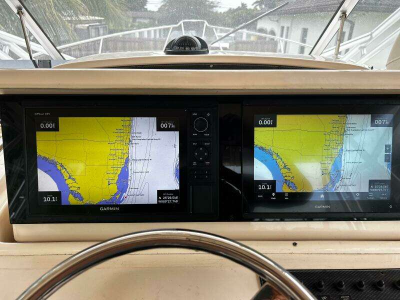 2007 Grady-White Express 330 boat dashboard with dual Garmin navigation screens.