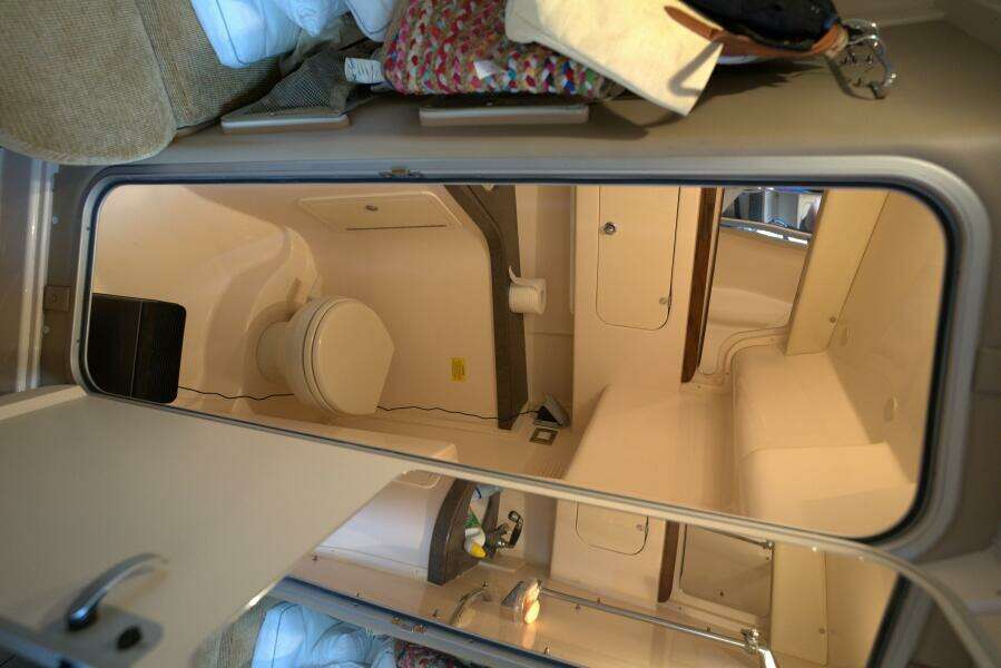Interior of 2007 Grady-White Express 330 boat, featuring a compact bathroom.