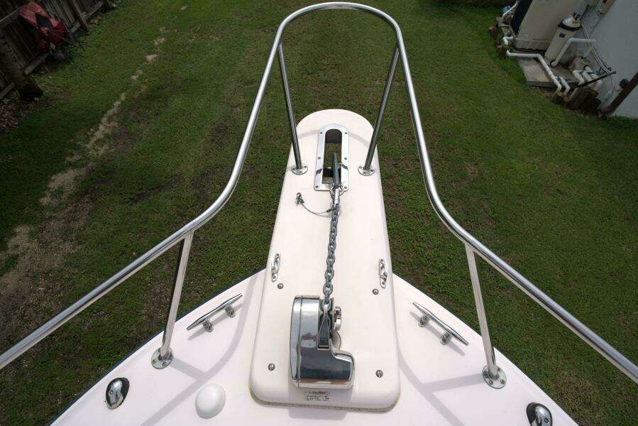 Bow of 2007 Grady-White Express 330 with anchor chain and railing.