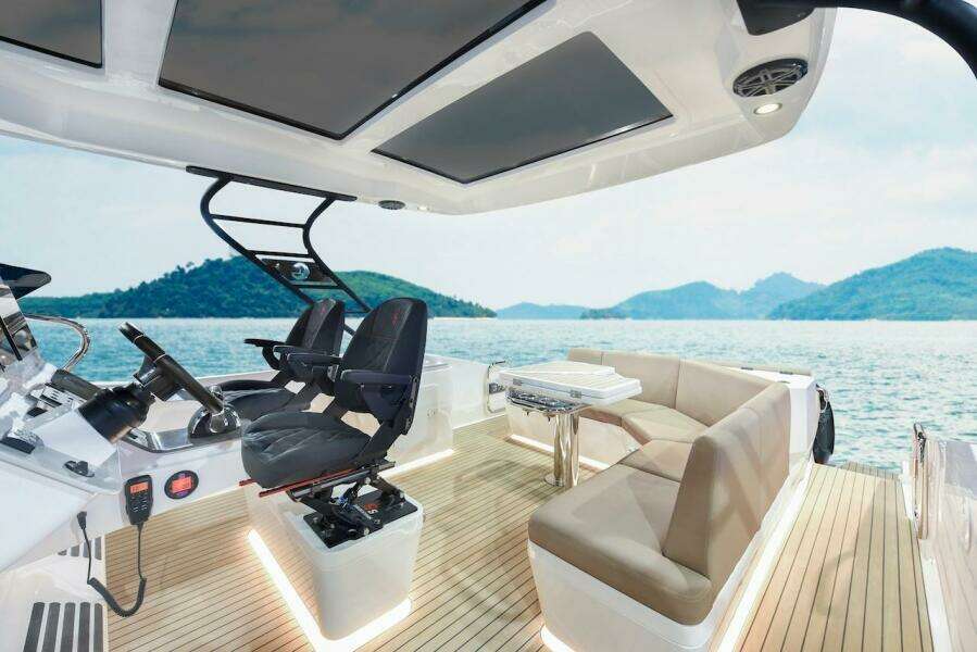 2024 Oryx 379 boat interior with luxurious seating and scenic ocean view.