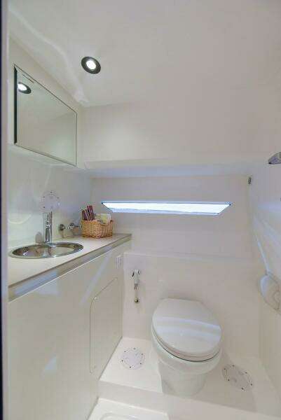 Modern bathroom in 2024 Oryx 379 boat with sleek white design.