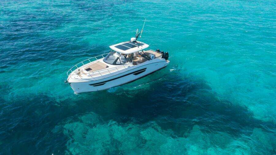 2024 Oryx 379 boat cruising on clear turquoise waters.