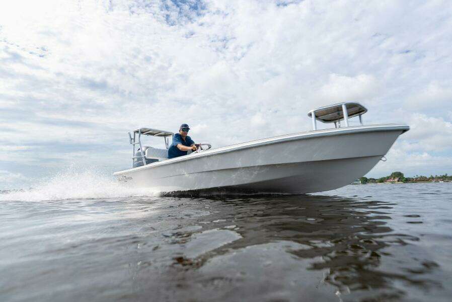 2025 BlueZones Boatworks 16' Flats boat cruising on open water.