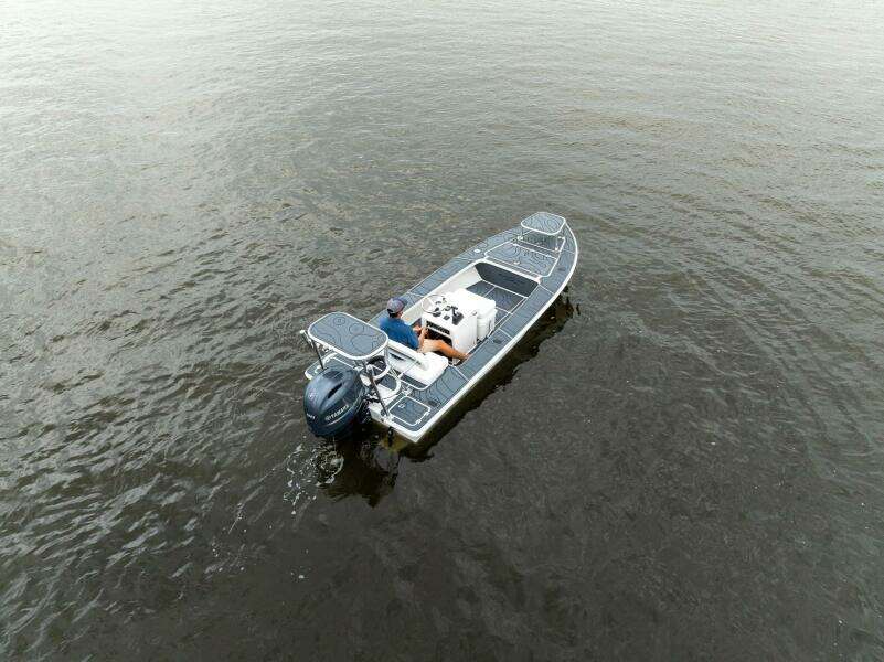 2025 BlueZones Boatworks 16' Flats on calm water, aerial view.