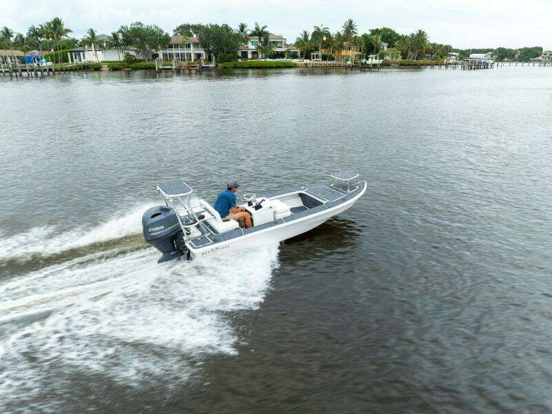 2025 BlueZones Boatworks 16' Flats cruising on a scenic waterway.