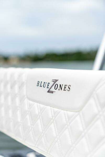 Close-up of BlueZones Boatworks 2025 16' Flats boat seat with logo.