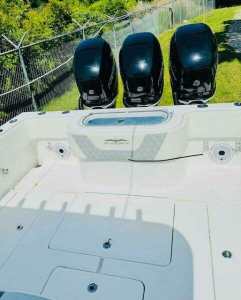 2022 Invincible 36 Open Fisherman boat with triple outboard engines.