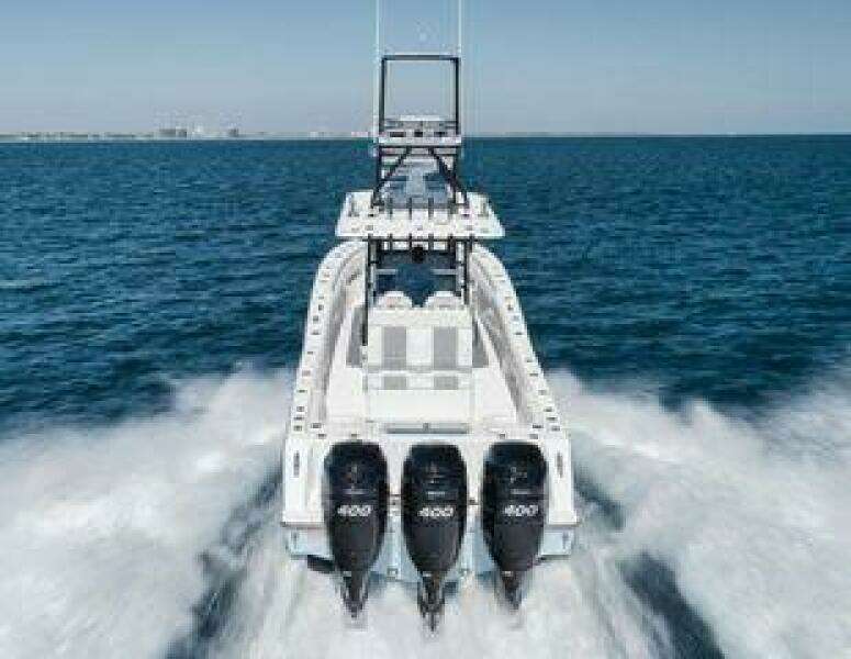 2022 Invincible 36 Open Fisherman boat speeding on open water.