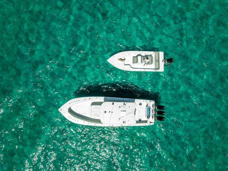 Aerial view of 2025 Billfish 39 Center Console boat on turquoise water.