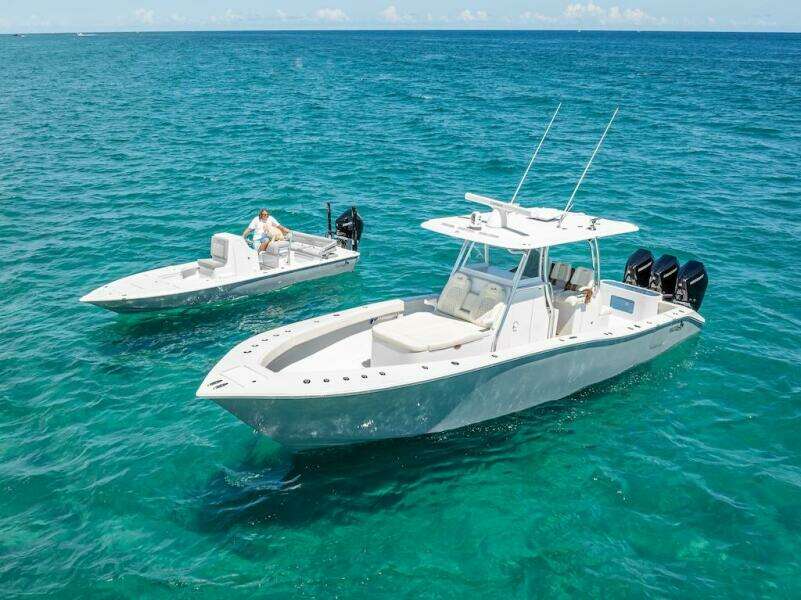 2025 Billfish 39 Center Console with Tower on clear blue water.