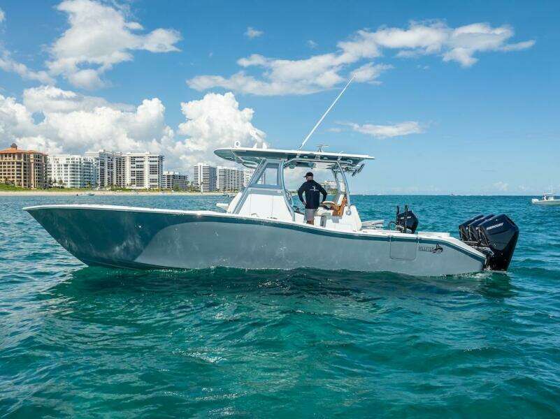 2025 Billfish 39 Center Console boat on ocean near city skyline.