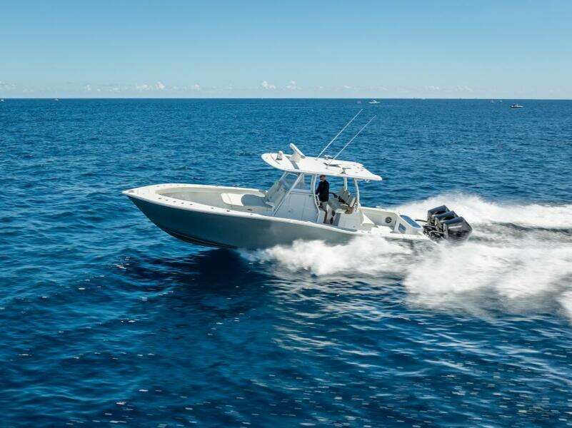 2025 Billfish 39 Center Console boat speeding on open ocean.