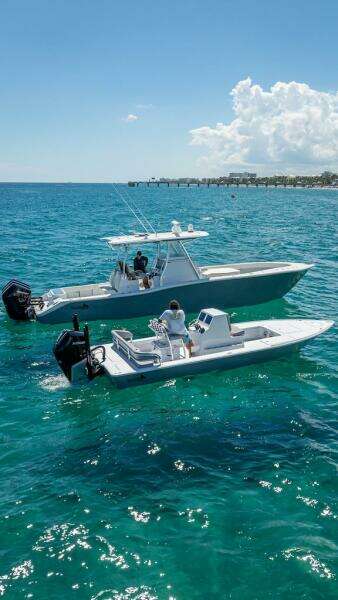 2025 Billfish 39 Center Console boats on clear blue ocean water.