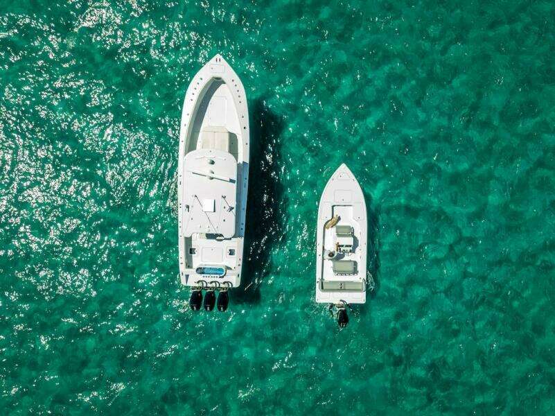 Aerial view of 2025 Billfish 39 Center Console boat on turquoise water.