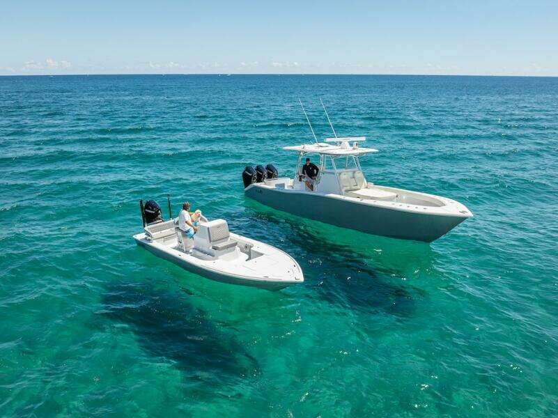 2025 Billfish 39 Center Console with Tower on clear blue ocean.