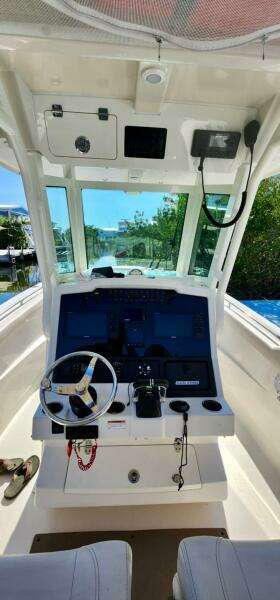 2021 Sailfish 272 CC boat cockpit with modern navigation equipment.
