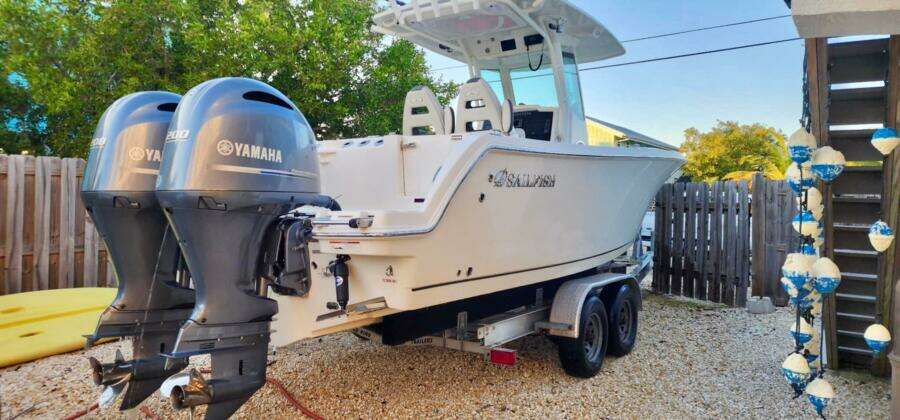 2021 Sailfish 272 CC boat with dual Yamaha engines on a trailer.