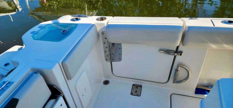 2021 Sailfish 272 CC boat interior with seating and storage compartments.